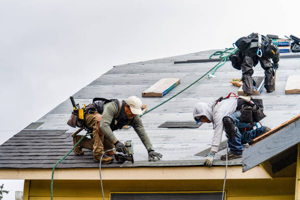 Professional Roofing technician working in Wenham, MA